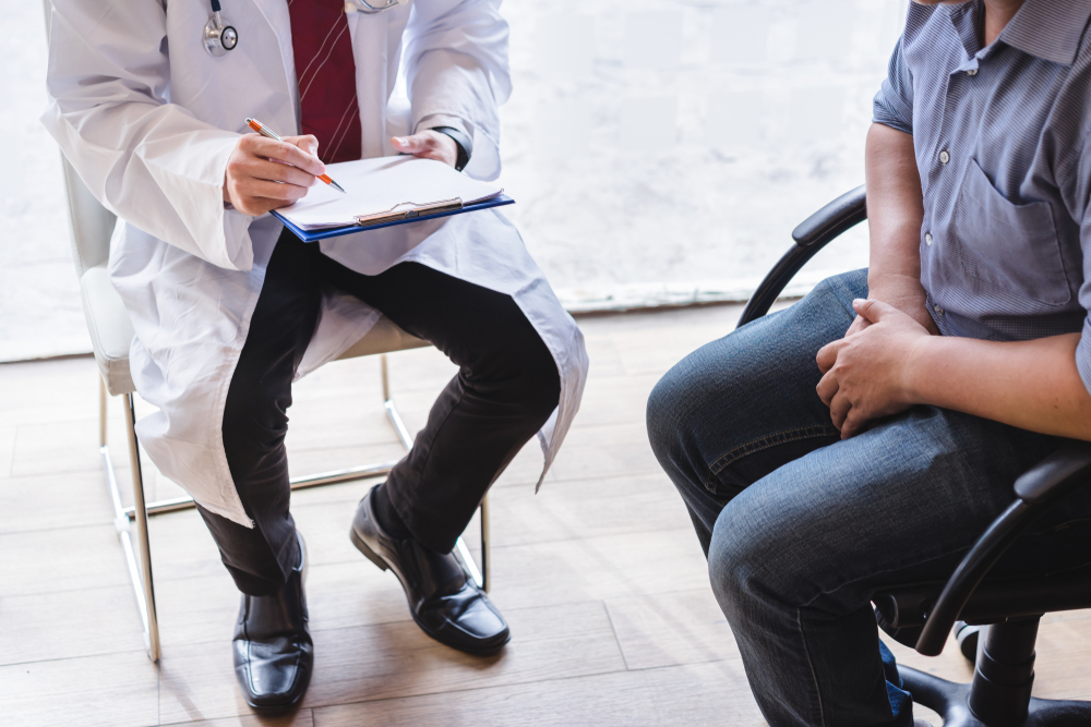 patient and urologist during urology appointment.